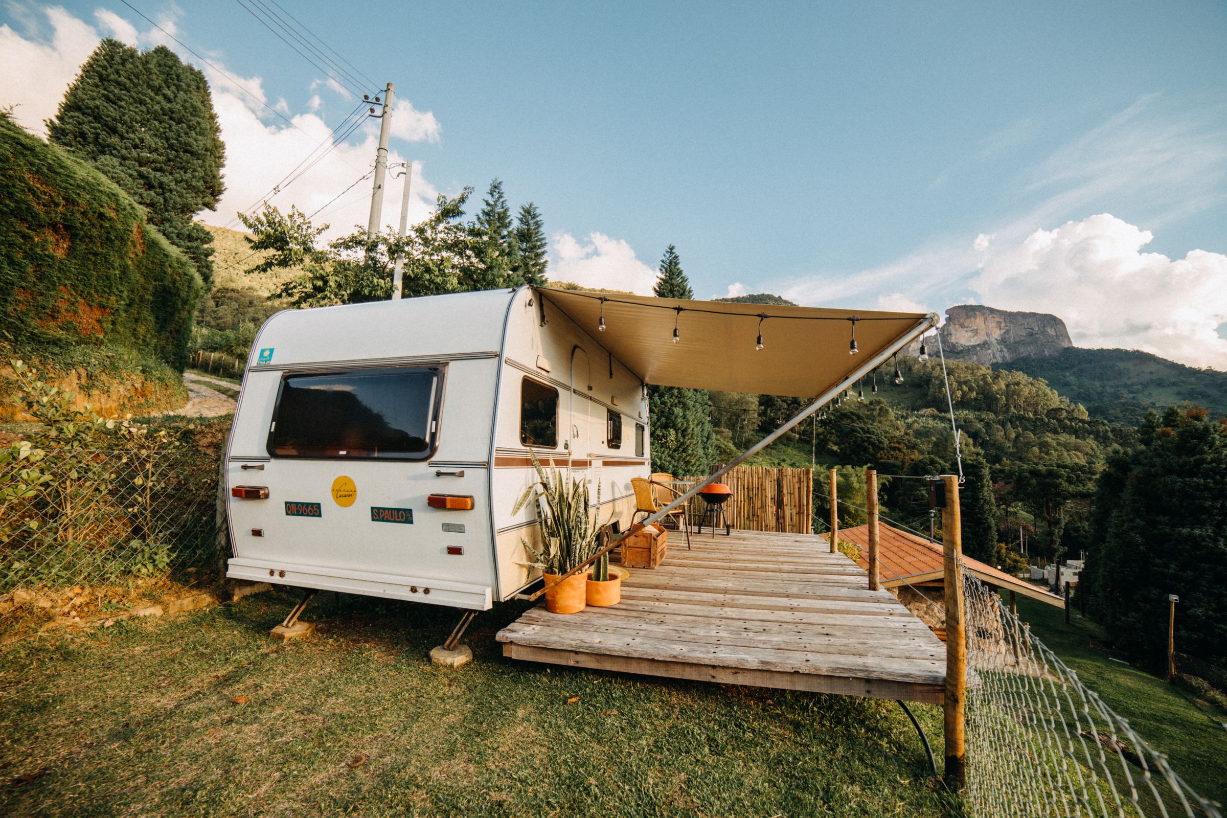 Travel trailer at a scenic lakeside campsite